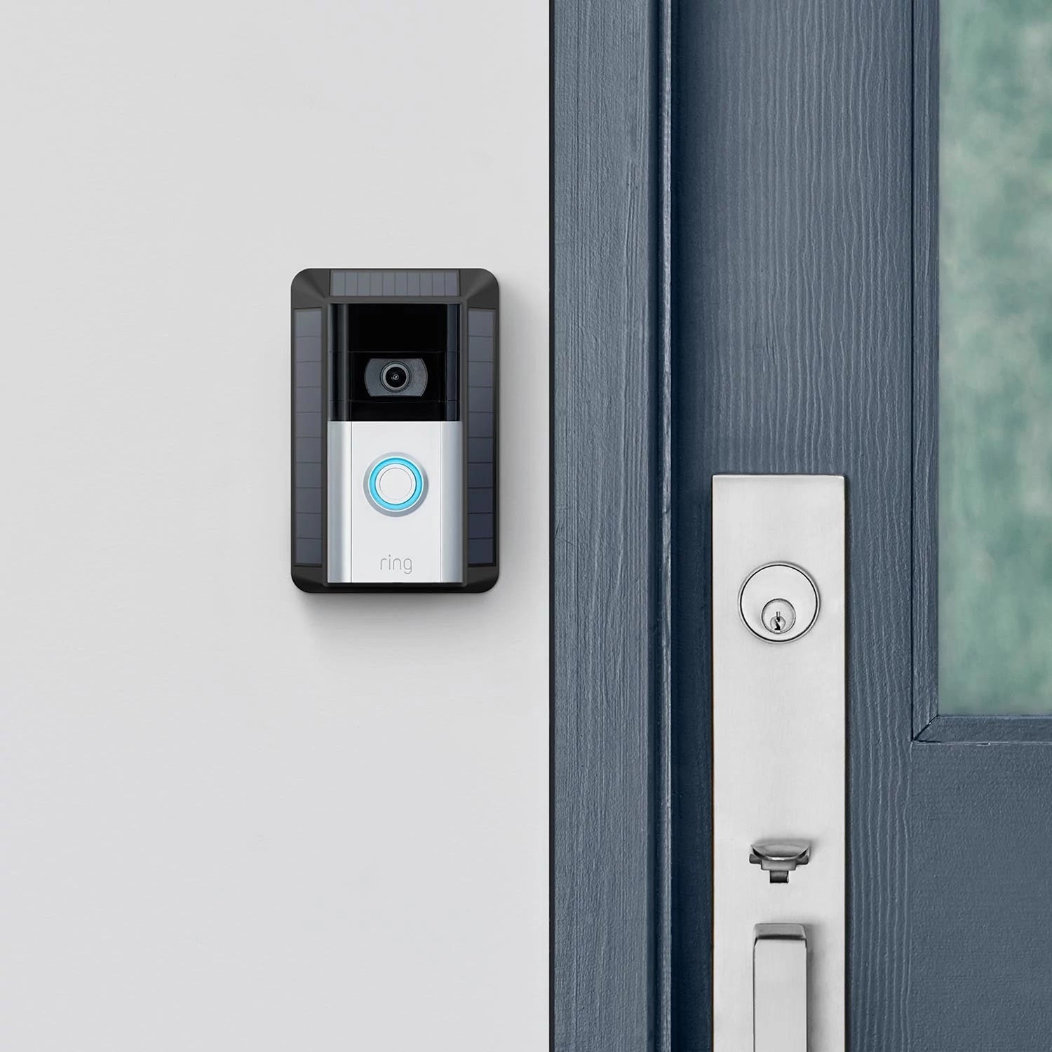 Solar Charger for Battery Doorbells (Video Doorbell 3, Video Doorbell 3 Plus, Video Doorbell 4, Battery Doorbell Plus, Battery Doorbell Pro) - Ring Battery Doorbell with Solar Charger, mounted by front door, showing camera, button, and built-in solar panels.