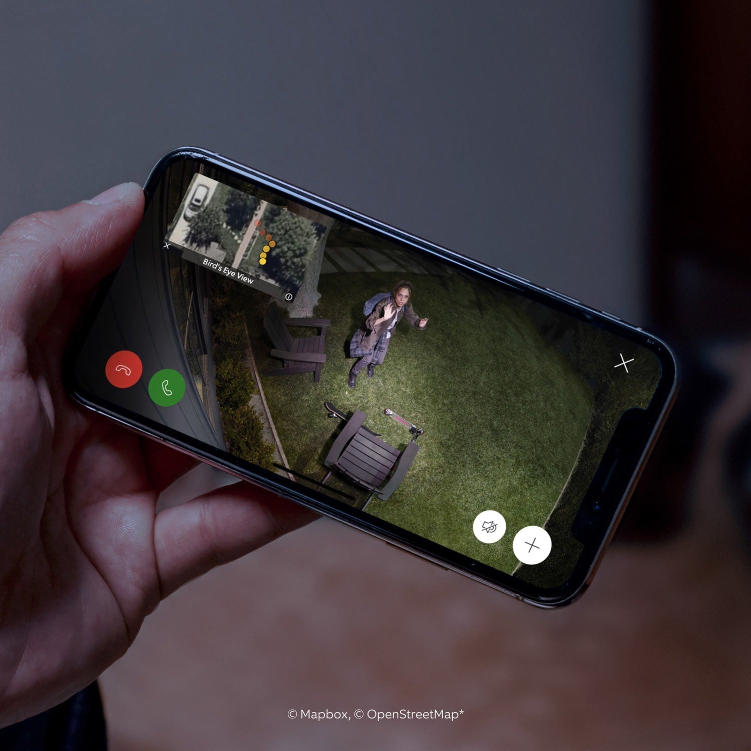 Spotlight Cam Pro (Featuring Retinal 2K) - Battery: Live Spotlight Cam Pro feed of waving woman at night, with Bird's Eye View, call controls, and person's path. 