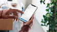 Hand scrolling through Ring device list on phone screen